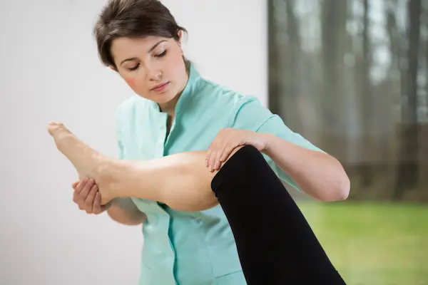 Manual knee manipulation and glute/hamstring massage